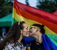 A couple kisses during the 11th Gay Pride Parade in downtown Sofia on June 9, 2018, as gays, lesbians and transsexuals march through Bulgarian capital to protest against discrimination against homosexuals and improve their integration in the society. - Thousands of people took to the streets to support LGBT rights in cities across Europe on June 9, 2018, with marchers waving rainbow flags and condemning discrimination in all its forms. (Photo by Dimitar DILKOFF / AFP) (Photo credit should read DIMITAR DILKOFF/AFP/Getty Images)