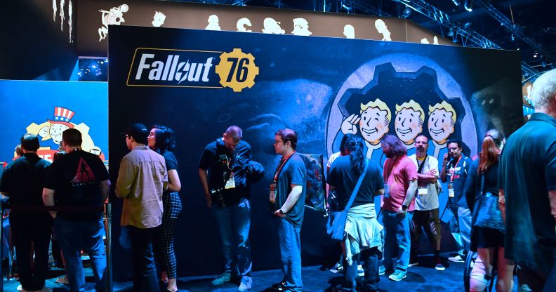 Gaming fans wait in line for freebies from Bethesda's Fallout 76 game.