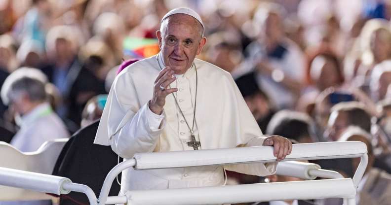 Pope Francis greets the crowd before celebrating a mass during the ecumenical meeting at the World Council of Churches (WCC) at Palexpo hall in Geneva, on June 21, 2018. - Pope Francis visits the World Council of Churches on 21 June as centrepiece of the ecumenical commemoration of the WCC's 70th anniversary. (Photo by MARTIAL TREZZINI / POOL / AFP) (Photo credit should read MARTIAL TREZZINI/AFP/Getty Images)