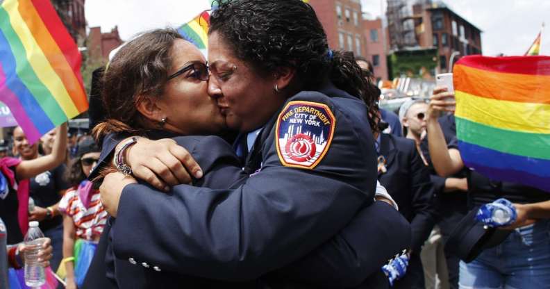 NEW YORK, NY - JUNE 24: EMT Trudy Bermudez and paramedic Tayreen Bonilla of New York City Fire Department get engaged at the annual Pride Parade on June 24, 2018 in New York City. The first gay pride parade in the U.S. was held in Central Park on June 28, 1970. (Photo by Kena Betancur/Getty Images)