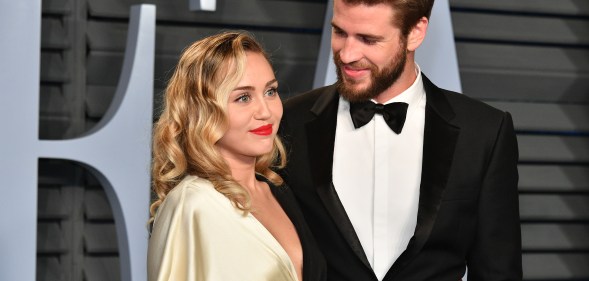 Miley Cyrus (left) and Liam Hemsworth