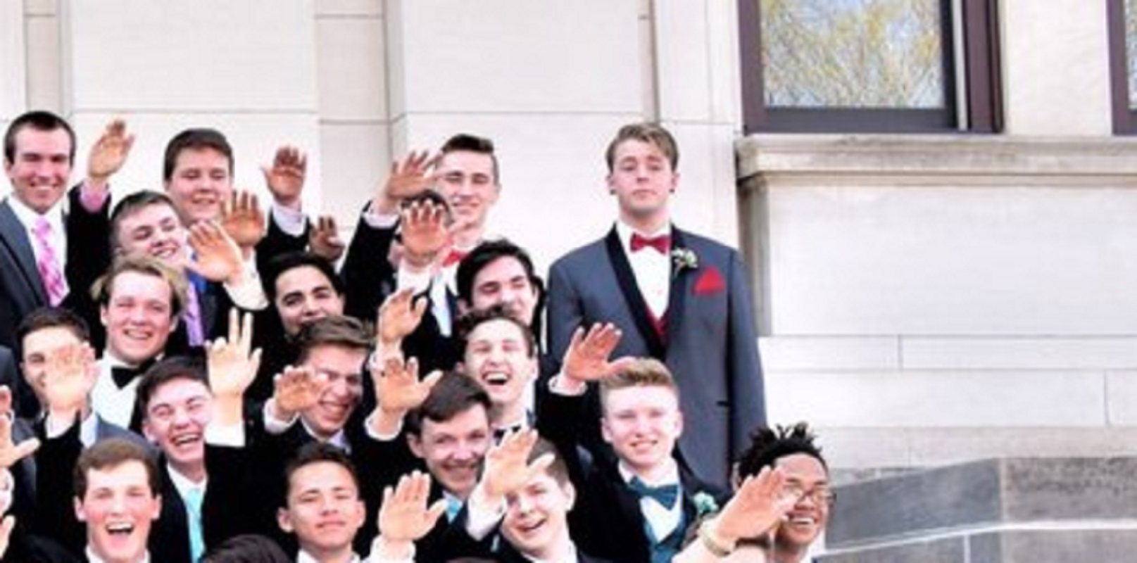 Jordan Blue stands defiant as many of his classmates do a 'mass Nazi salute'