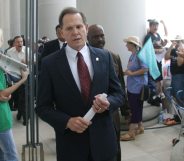 MONTGOMERY, AL ? AUGUST 21: Alabama Supreme Court Chief Justice Roy Moore walks back into the state Judicial Building after addressing supporters August 21, 2003 in Montgomery, Alabama. The eight other justices today overruled Moore?s defiance of a federal court order to remove a 5,300 lb granite monument of the Ten Commandments that is exhibited in the Judicial Building. Moore defied a deadline to get rid of the monument by midnight today. The U.S. Supreme Court declined to consider the issue Wednesday. (Photo by Gary Tramontina/Getty Images)