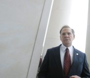 MONTGOMERY, AL ? AUGUST 21: Alabama Supreme Court Chief Justice Roy Moore walks back into the state Judicial Building after addressing supporters August 21, 2003 in Montgomery, Alabama. The eight other justices today overruled Moore?s defiance of a federal court order to remove a 5,300 lb granite monument of the Ten Commandments that is exhibited in the Judicial Building. Moore defied a deadline to get rid of the monument by midnight today. The U.S. Supreme Court declined to consider the issue Wednesday. (Photo by Gary Tramontina/Getty Images)