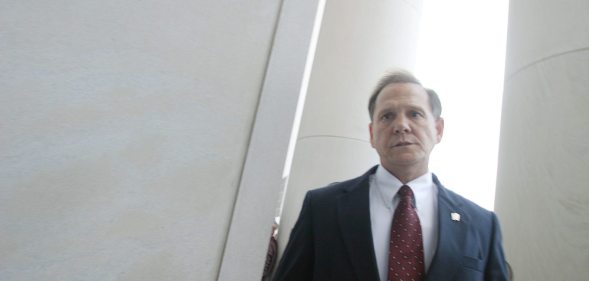 MONTGOMERY, AL ? AUGUST 21: Alabama Supreme Court Chief Justice Roy Moore walks back into the state Judicial Building after addressing supporters August 21, 2003 in Montgomery, Alabama. The eight other justices today overruled Moore?s defiance of a federal court order to remove a 5,300 lb granite monument of the Ten Commandments that is exhibited in the Judicial Building. Moore defied a deadline to get rid of the monument by midnight today. The U.S. Supreme Court declined to consider the issue Wednesday. (Photo by Gary Tramontina/Getty Images)