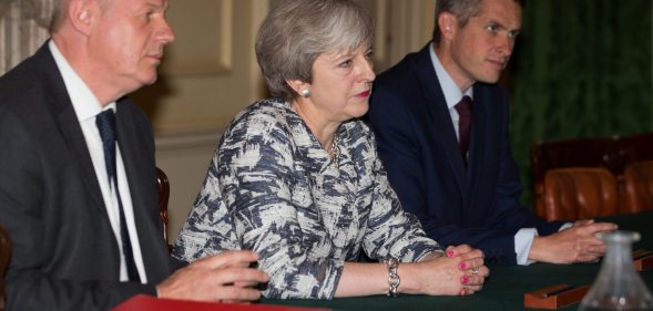 LONDON, ENGLAND - JUNE 26: Prime Minister Theresa May (2L) sits with First Secretary of State Damian Green (L), and Parliamentary Secretary to the Treasury, and Chief Whip, Gavin Williamson (3L) as they talk with Democratic Unionist Party (DUP) leader Arlene Foster, DUP Deputy Leader Nigel Dodds, and DUP MP Jeffrey Donaldson (not seen) inside 10 Downing Street on June 26, 2017 in London, England. Prime Minister Theresa May's Conservatives signed a deal Monday with Northern Ireland's Democratic Unionist Party that will allow them to govern after losing their majority in a general election this month. (Photo by Daniel Leal-Olivas - WPA Pool /Getty Images)