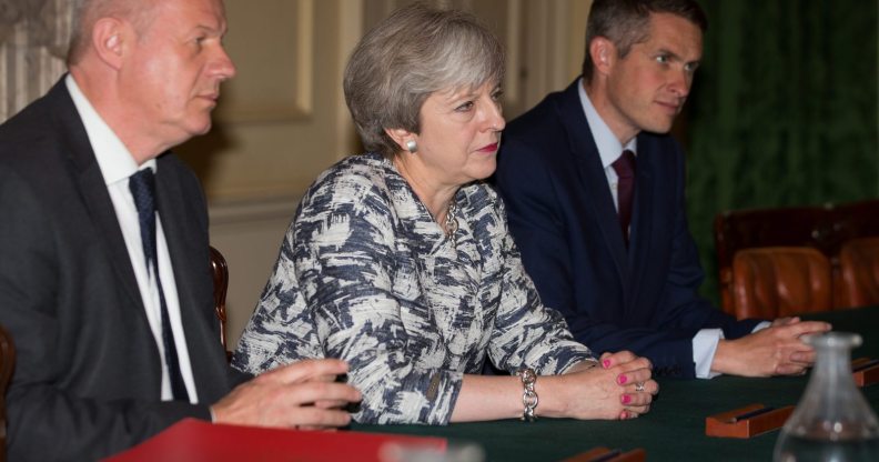 LONDON, ENGLAND - JUNE 26: Prime Minister Theresa May (2L) sits with First Secretary of State Damian Green (L), and Parliamentary Secretary to the Treasury, and Chief Whip, Gavin Williamson (3L) as they talk with Democratic Unionist Party (DUP) leader Arlene Foster, DUP Deputy Leader Nigel Dodds, and DUP MP Jeffrey Donaldson (not seen) inside 10 Downing Street on June 26, 2017 in London, England. Prime Minister Theresa May's Conservatives signed a deal Monday with Northern Ireland's Democratic Unionist Party that will allow them to govern after losing their majority in a general election this month. (Photo by Daniel Leal-Olivas - WPA Pool /Getty Images)