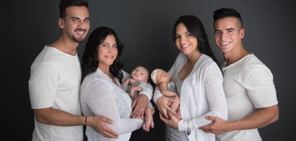 Mothers Mariely Martinez,left, and Carla Melendez, right with fathers Juny Roman and Alex Torres and newborns Marla and Matteo