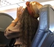 Woman yells homophobic and racist slurs at plane passenger