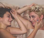 Women looking satisfied in bed, which according to LGBT+ science is normal for women who have sex with women.