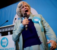 Ann Widdecombe holding a microphone