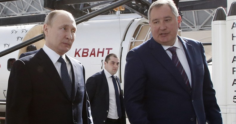 Russian President Vladimir Putin talks with Russian Deputy Prime Minister and Head of ROSCOSMOS Dmitry Rogozin