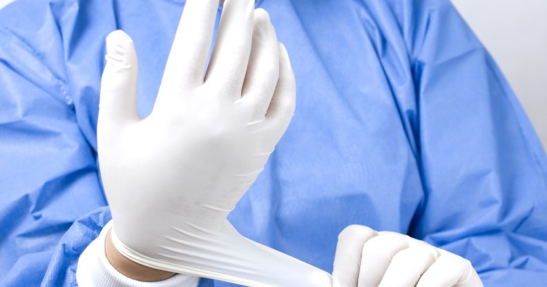 Doctor puts on a glove