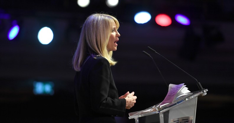 Esther McVey speaking at a podium