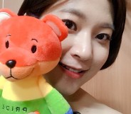 Writer Eun Ha-sun poses with a LGBT teddy bear in a photo uploaded on Facebook, where she tricked homophobes to donate to the Seoul Pride festival