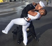 Bryan Woodington and Kenneth Woodington kissing after Bryan gets back from seven months in the Middle East on the USS The Sullivans