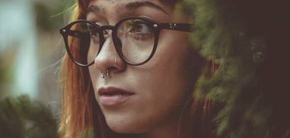 Girl with glasses and septum piercing