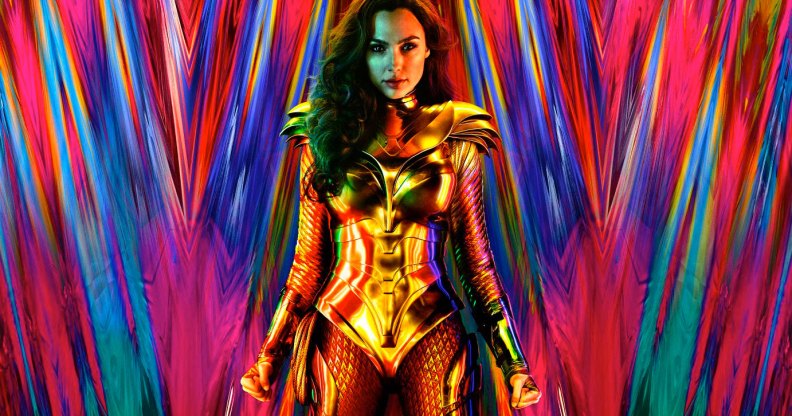 Gal Gadot as Wonder Woman in a gold suit in front of a multicoloured backdrop