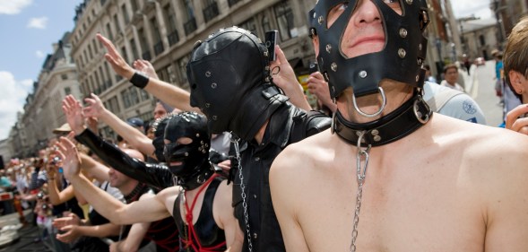 Men in bondage wear at Pride