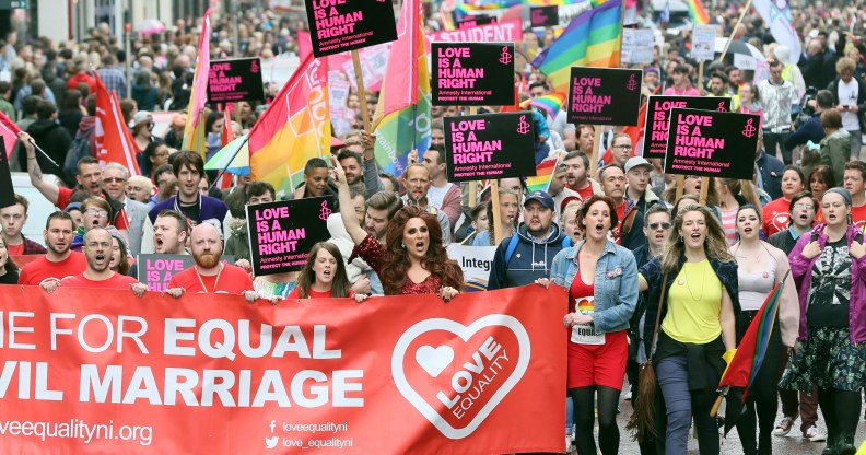 Equal rights campaigners take part in a march through Belfast on July 1, 2017 to protest against the ban on same-sex marriage.