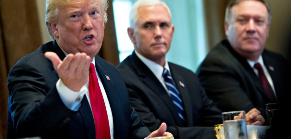 President Donald Trump speaks alongside Vice President Mike Pence and Secretary of State Mike Pompeo