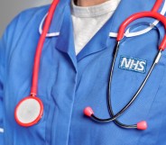 An NHS staff member wearing a stethoscope