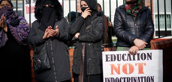 Parents, children and protesters demonstrate against the 'No Outsiders' programme, which teaches children about LGBT rights, at Parkfield Community School on March 21, 2019 in Birmingham, England.