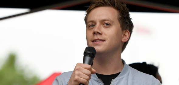 Guardian columnist Owen Jones speaks to the crowd during an Anti-Trump protest in London.