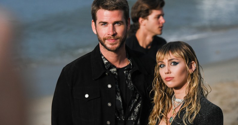 Liam Hemsworth and Miley Cyrus at Saint Laurent mens spring summer 20 show on June 06, 2019 in Malibu, California.