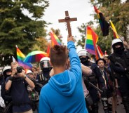 Poland plock equality parade blocked by teenager with crucifix