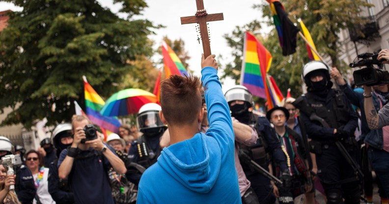 Poland plock equality parade blocked by teenager with crucifix