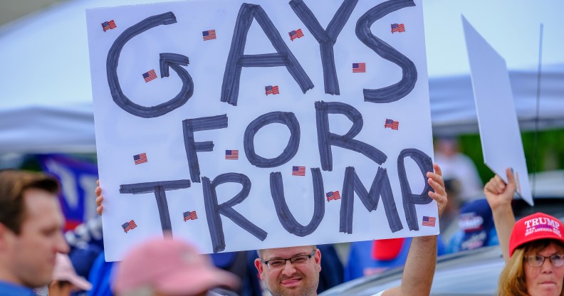 LGB Republican holds banner that reads 'Gays for Trump'