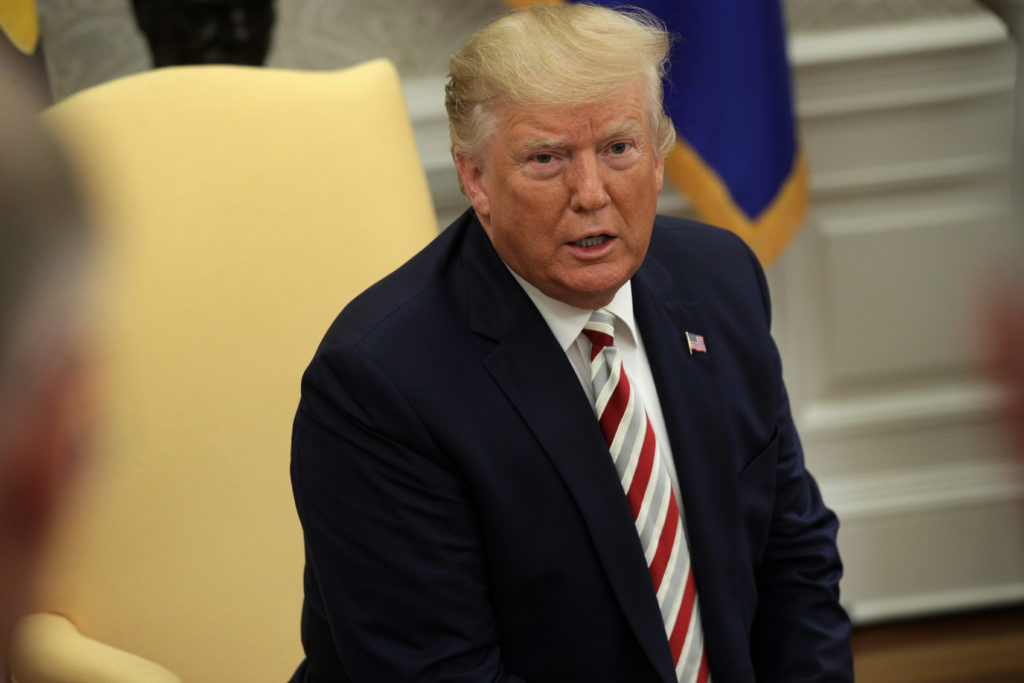 President Donald Trump speaks to members of the media in the Oval Office of the White House August 20, 2019 in Washington, DC.