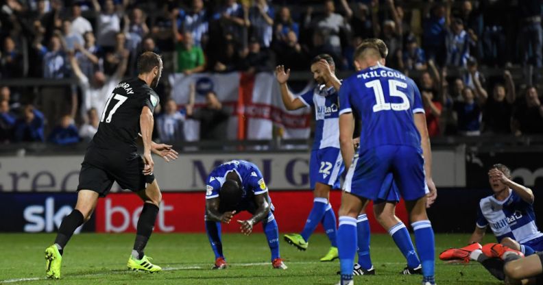 Bristol Rover players (right) on the pitch with Brighton & Hove Albion at Memorial Stadium, Bristol (Getty Images/Alex Davidson)