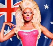 RuPaul in front of an Australian flag