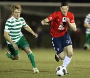 Andy Brennan and another player on the pitch