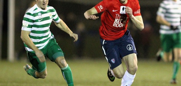 Andy Brennan and another player on the pitch