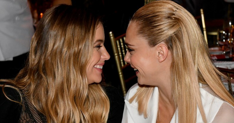 Cara Delevingne and Ashley Benson facing each other, smiling