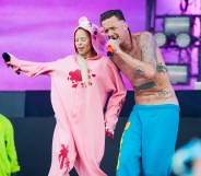 Die Antwoord's Yolandi in a pink onesie and Ninja in blue trousers