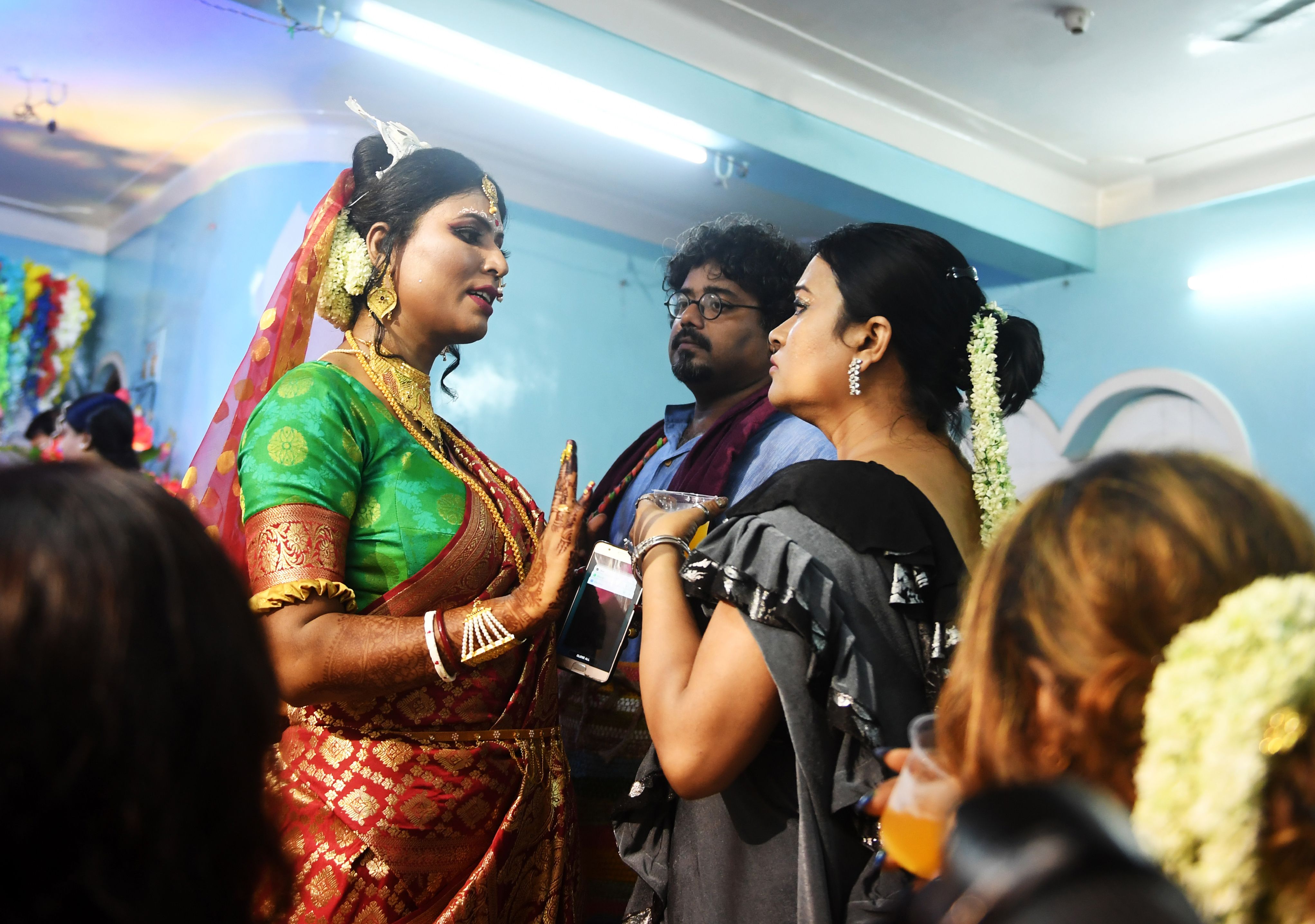 A bride greeting wedding guests