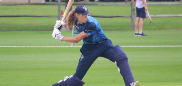 Maxine Blythin swinging a cricket bat