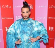 Nico Tortorella in a blue dress