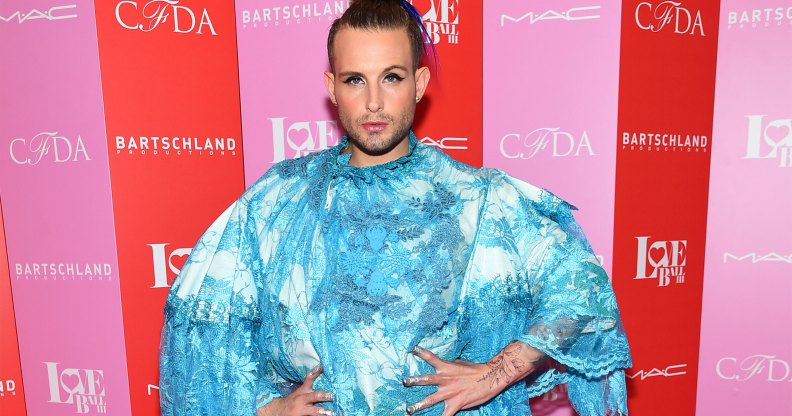 Nico Tortorella in a blue dress