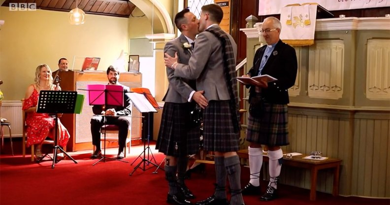 Jamie Wallace and Ian McDowall kissing at the altar