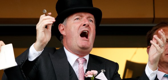 Piers Morgan smokes a cigar whilst watching the racing on day two of Royal Ascot at Ascot Racecourse on June 19, 2019 in Ascot, England.