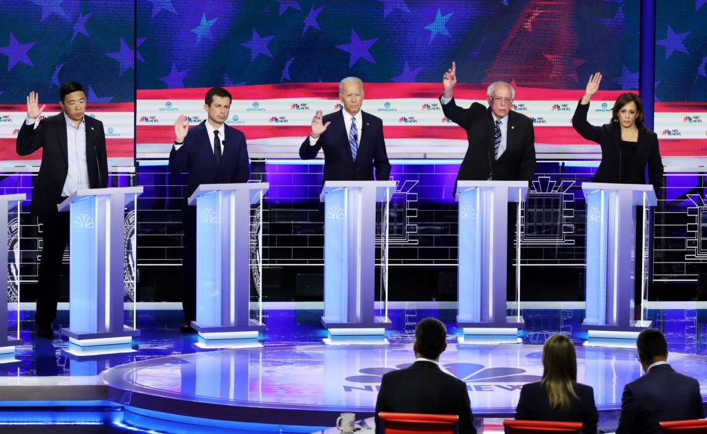 Andrew Yang (far left) and Bernie Sanders (centre-right) are both set to skip Human Rights Campaign and GLAAD events 