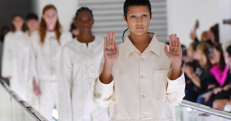 Non-binary model Ayesha Tan Jones protested mid-catwalk against Italian fashion house Gucci's use of straight jackets in its SS20 collection. (Jacopo Raule/Getty Images for Gucci)