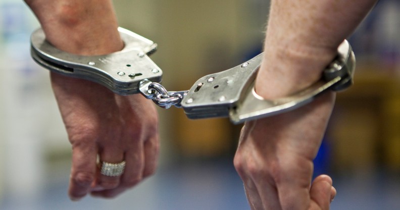 A prisoner's hands in handcuffs