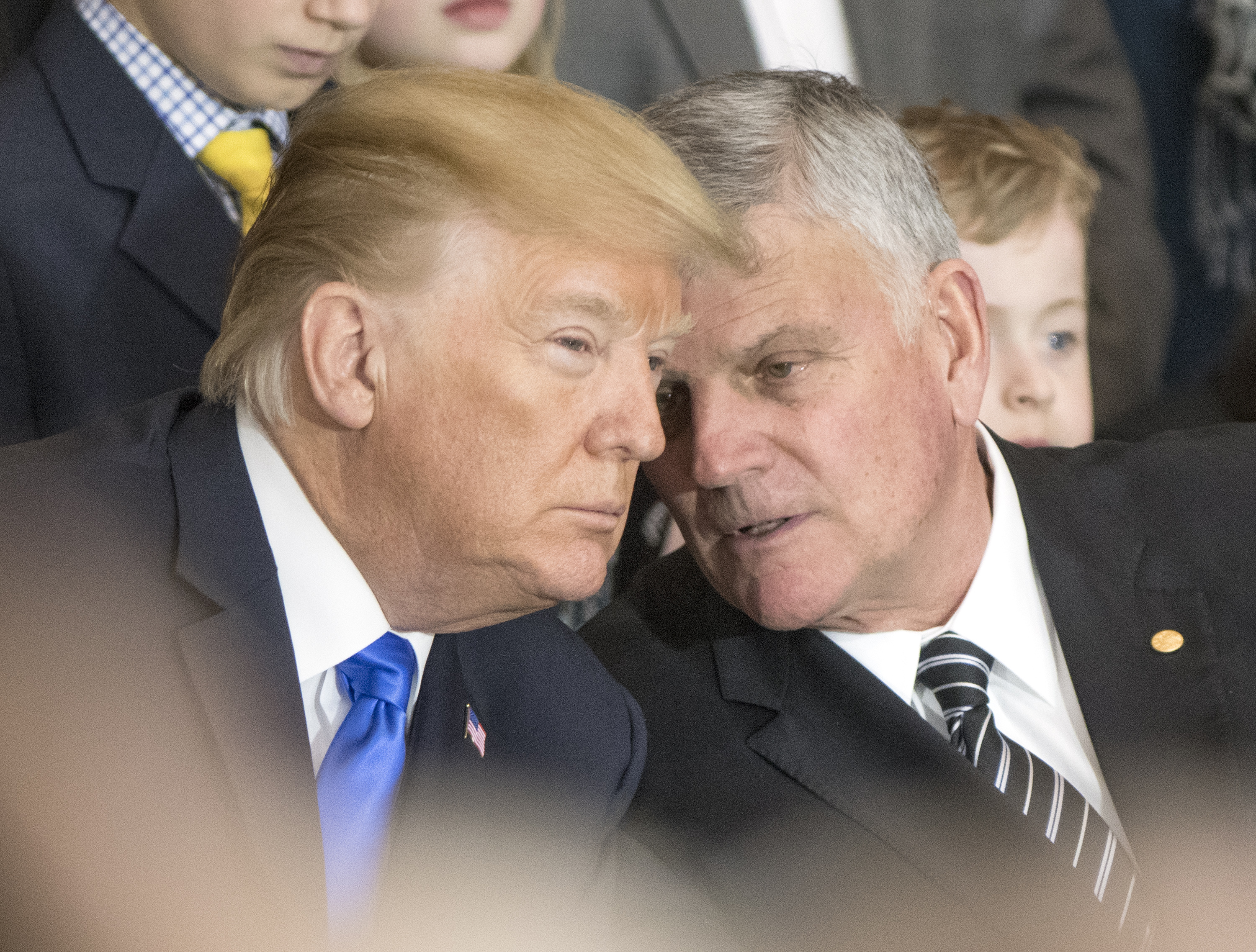 Franklin Graham (R) talks with President Donald Trump