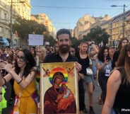 Nik Jovičić-Sas carrying a homemade Virgin Mary icon with a rainbow halo at Belgrade Pride 2019, Serbia. (Nik Jovičić-Sas)